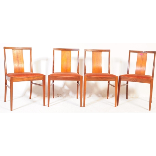 654 - British Modern Design - Mid 20th century teak drop leaf dining table with four chairs. The table of ... 