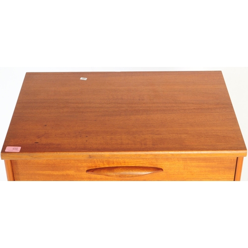 656 - Austinsuite - A mid 20th century teak Tallboy chest of drawers. Of rectangular form with a bank of s... 