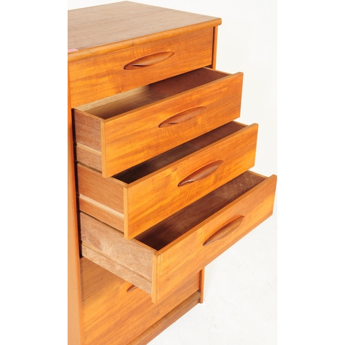 656 - Austinsuite - A mid 20th century teak Tallboy chest of drawers. Of rectangular form with a bank of s... 