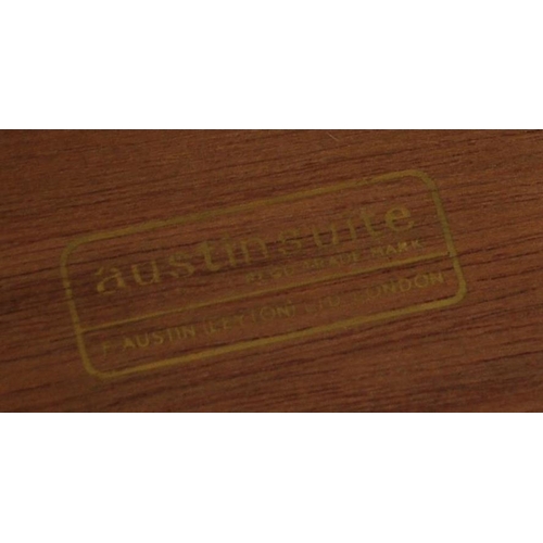 656 - Austinsuite - A mid 20th century teak Tallboy chest of drawers. Of rectangular form with a bank of s... 