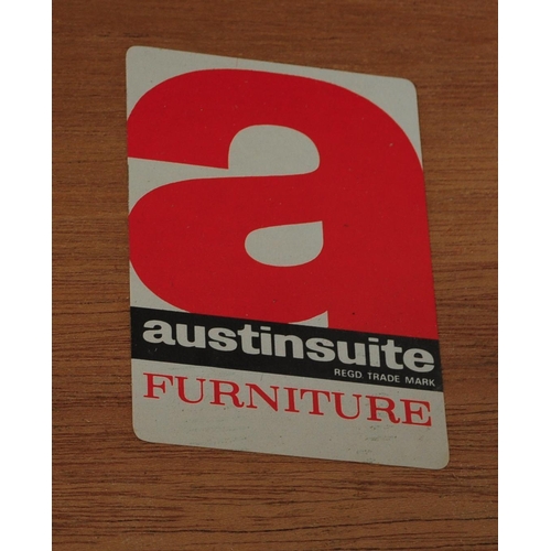 656 - Austinsuite - A mid 20th century teak Tallboy chest of drawers. Of rectangular form with a bank of s... 