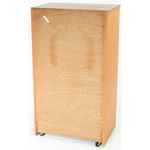 656 - Austinsuite - A mid 20th century teak Tallboy chest of drawers. Of rectangular form with a bank of s... 