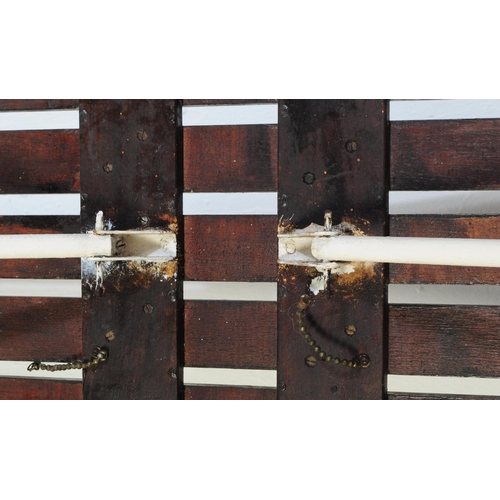 658 - A vintage 20th century folding gym bench. Of rectangular form with five wooden slate top with painte... 