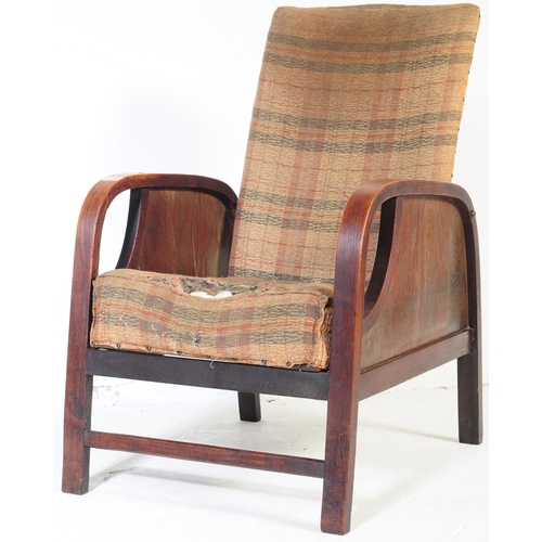 662 - A vintage 20th century circa 1930s Art Deco reclining armchair. Having a square chequered pattern up... 