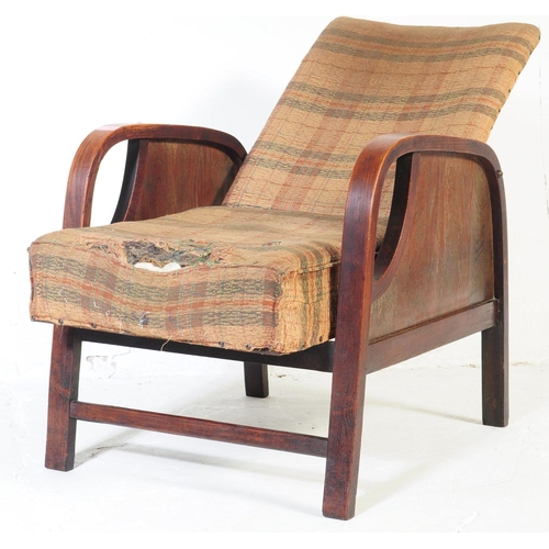 662 - A vintage 20th century circa 1930s Art Deco reclining armchair. Having a square chequered pattern up... 