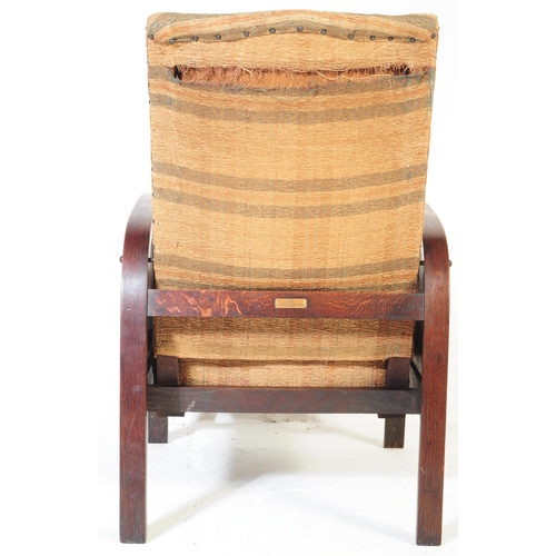 662 - A vintage 20th century circa 1930s Art Deco reclining armchair. Having a square chequered pattern up... 