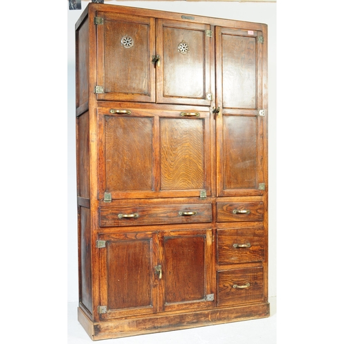 663 - A vintage 20th century oak kitchen larder pantry cabinet. Of rectangular form with a configuration o... 