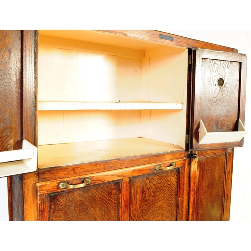 663 - A vintage 20th century oak kitchen larder pantry cabinet. Of rectangular form with a configuration o... 