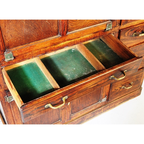 663 - A vintage 20th century oak kitchen larder pantry cabinet. Of rectangular form with a configuration o... 