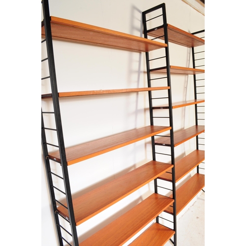 664 - A vintage mid 20th century Ladderax wall unit. Total of three bays with twelve teak shelves, ebonise... 