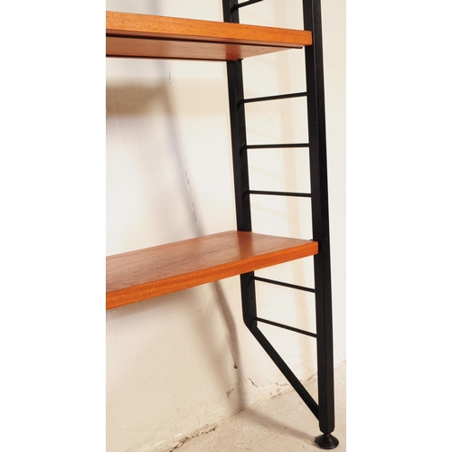 664 - A vintage mid 20th century Ladderax wall unit. Total of three bays with twelve teak shelves, ebonise... 