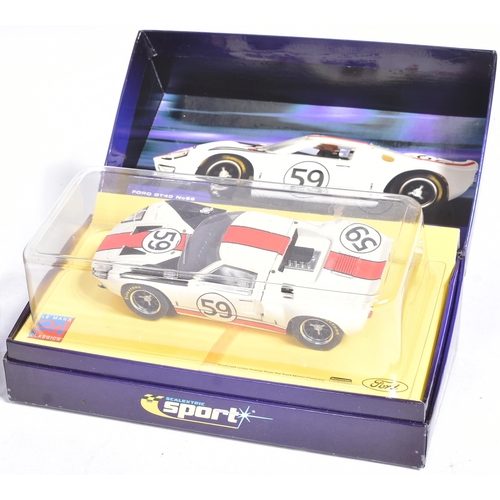 122 - Scalextric - a collection of x3 Hornby made slot car racing cars comprising; C2464A Ford GT MKII 196... 