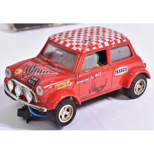 143 - Scalextric - x3 vintage Triang Scalextric slot car racing car minis comprising; C76 Austin Mini Coop... 