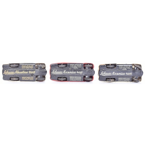 160 - Schuco - a collection of x3 vintage Examico 4001 tinplate clockwork cars, two in cream the other in ... 