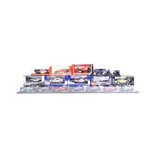 165 - Diecast - a collection of assorted diecast model racing cars of Formula One and Rally interest by ma... 