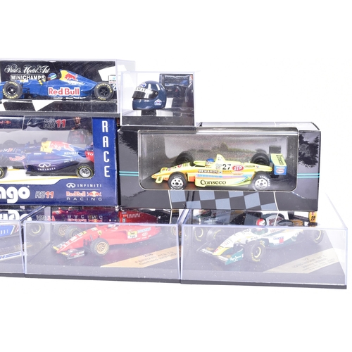 165 - Diecast - a collection of assorted diecast model racing cars of Formula One and Rally interest by ma... 