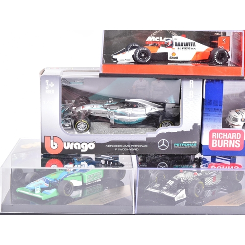 165 - Diecast - a collection of assorted diecast model racing cars of Formula One and Rally interest by ma... 