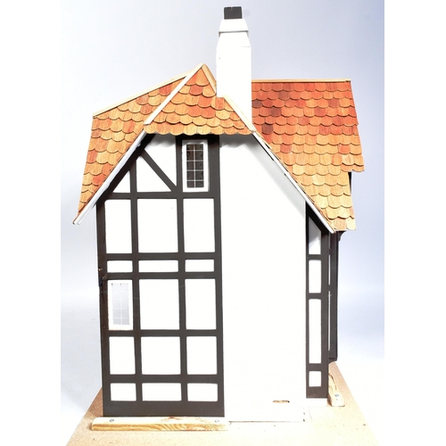 175 - Doll's House - a 20th century Mock Tudor style manor / country house dolls house. Four rooms, with a... 