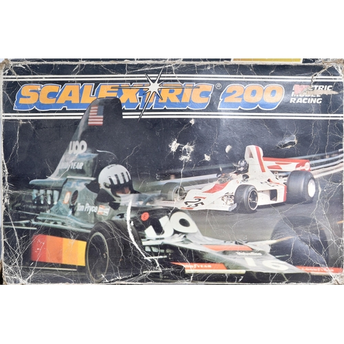 224 - Scalextric - an original vintage Hornby Scalextric 200 slot car racing set No. C559 along with addit... 