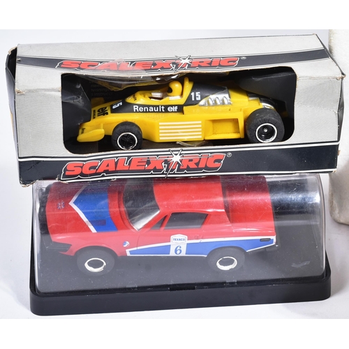 224 - Scalextric - an original vintage Hornby Scalextric 200 slot car racing set No. C559 along with addit... 