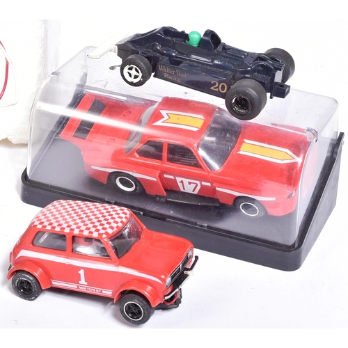 224 - Scalextric - an original vintage Hornby Scalextric 200 slot car racing set No. C559 along with addit... 