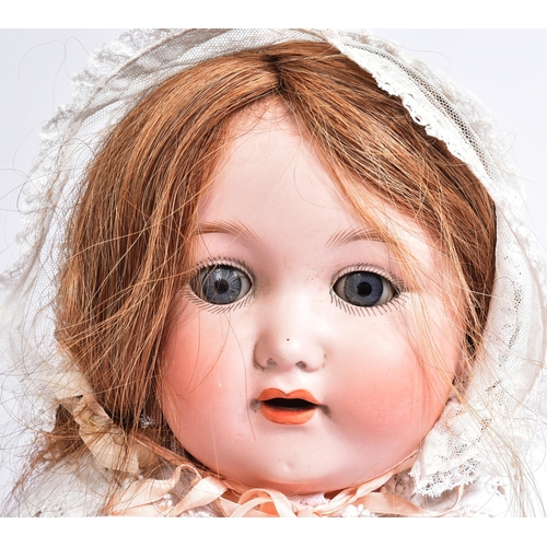 274 - An early 20th Century German Otto Gans for Armand Marseille bisque headed doll. The doll with blue f... 