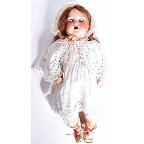 274 - An early 20th Century German Otto Gans for Armand Marseille bisque headed doll. The doll with blue f... 