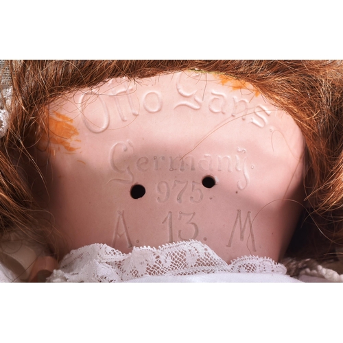 274 - An early 20th Century German Otto Gans for Armand Marseille bisque headed doll. The doll with blue f... 