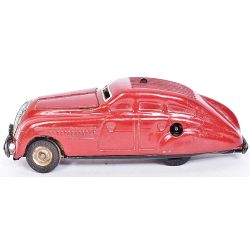 3 - Schuco - a vintage German Kommando Anno 2000 clockwork tinplate model car. Red, with hinged opening ... 