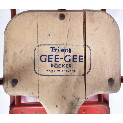 307 - A vintage Triang / Tri-ang childrens rocking horse ' Gee-Gee Rocker ' on a red metal frame with seat... 