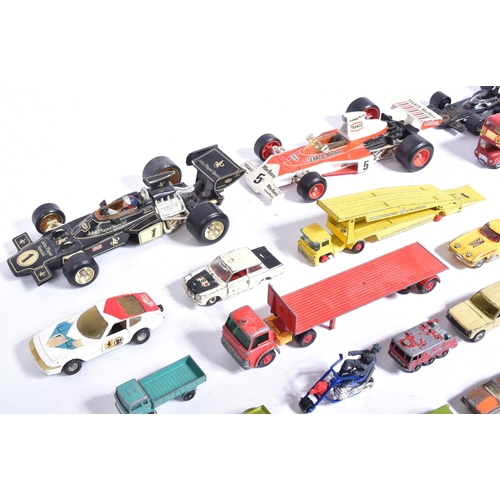 309 - Diecast - a collection of vintage unboxed diecast model cars to include; Corgi 1/18 John Player Spec... 