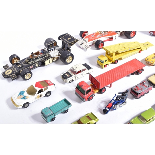 309 - Diecast - a collection of vintage unboxed diecast model cars to include; Corgi 1/18 John Player Spec... 