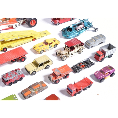 309 - Diecast - a collection of vintage unboxed diecast model cars to include; Corgi 1/18 John Player Spec... 