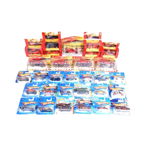 425 - Diecast - a collection of assorted early 2000s Mattel made HotWheels carded diecast models along wit... 