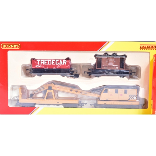 44 - Model Railway - three vintage Hornby OO gauge railroad trainsets, comprising of; R8263 Car Unloading... 