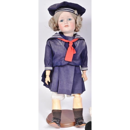 467 - Two early 20th Century style reproduction dolls comprising a large French Bru doll and a smaller Ger... 