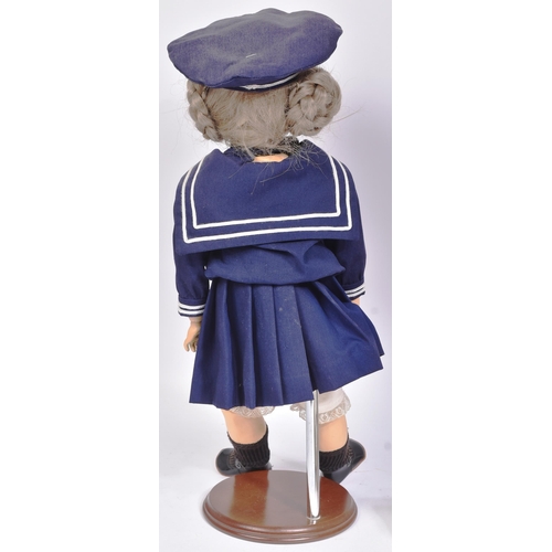 467 - Two early 20th Century style reproduction dolls comprising a large French Bru doll and a smaller Ger... 