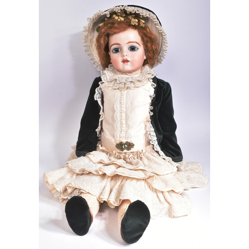 467 - Two early 20th Century style reproduction dolls comprising a large French Bru doll and a smaller Ger... 