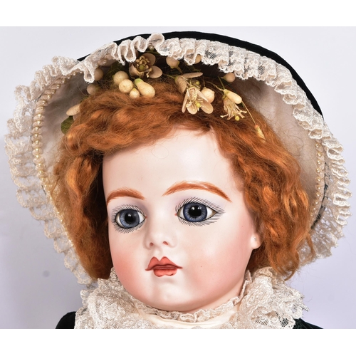 467 - Two early 20th Century style reproduction dolls comprising a large French Bru doll and a smaller Ger... 