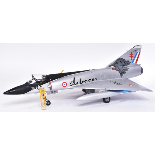 469 - Model kits - a collection of x3 built model kits of aircraft interest, comprising of; a Dassault Mir... 