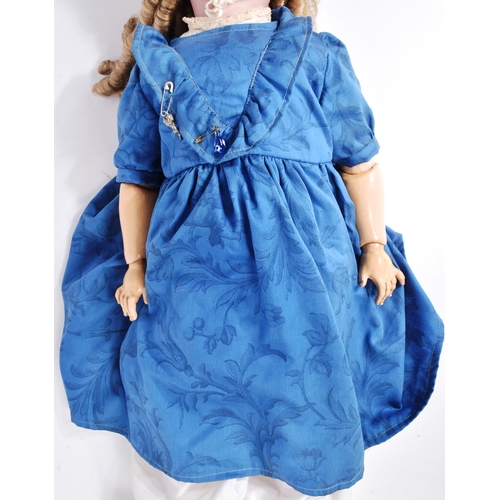 483 - An early 20th Century German Simon & Halbig bisque headed doll. The doll with brown flirty eyes, fin... 