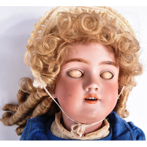 483 - An early 20th Century German Simon & Halbig bisque headed doll. The doll with brown flirty eyes, fin... 