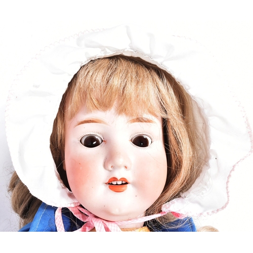 484 - An early 20th Century German Armand Marseille bisque headed doll. The doll with brown flirty eyes (i... 