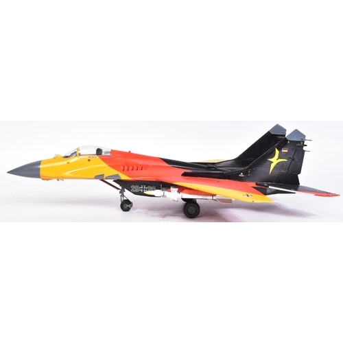 506 - Models - a scale plastic model of a MIG 29A German Luftwaffe Bernd 'Hooters' Pfahler jet, in black, ... 