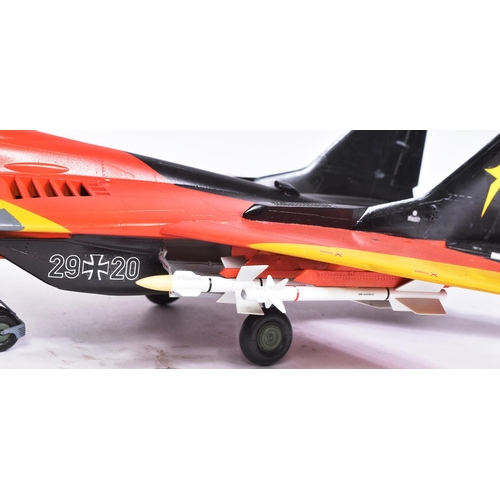 506 - Models - a scale plastic model of a MIG 29A German Luftwaffe Bernd 'Hooters' Pfahler jet, in black, ... 