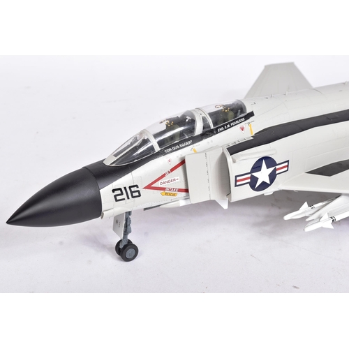 511 - Models - a scale plastic model of a US Navy Fantom F-4 5579 USS Midway jet, in grey, with black and ... 