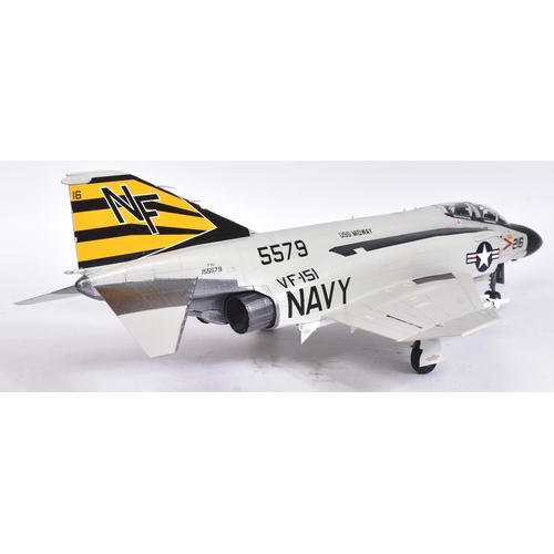 511 - Models - a scale plastic model of a US Navy Fantom F-4 5579 USS Midway jet, in grey, with black and ... 