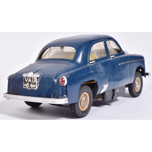 54 - An original vintage 1950s Victory Industries battery operated model car of a Vauxhall Velox. Plastic... 