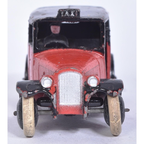 7 - Dinky - 36G Taxi With Driver - an early c1930s pre-war diecast Dinky Toy model of a Taxi in maroon w... 