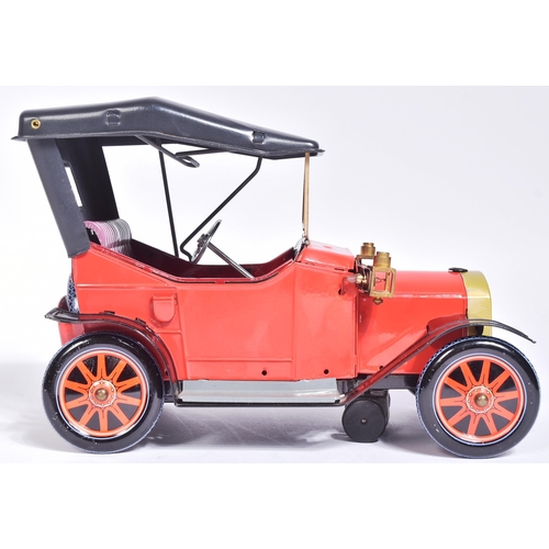 9 - Tinplate Toys - a vintage Japanese (Nomura) made tinplate battery operated model '  Veteran Car '. T... 